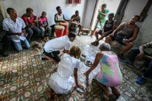 Female Santeria priestesses are still fighting for general acceptance. By ADALBERTO ROQUE AFP