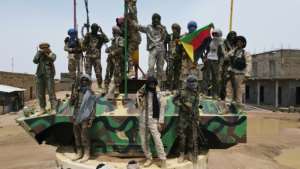 Fighters from the National Movement for the Liberation of Azawad MNLA, part of the CMA alliance, pose for a picture during the August talks. By SOULEYMANE AG ANARA AFP