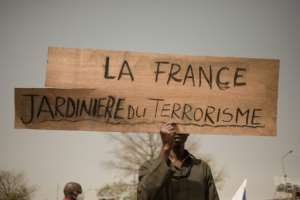 'France, cultivator of terrorism': A placard at an anti-French rally in the Malian capital Bamako in February. By FLORENT VERGNES AFPFile