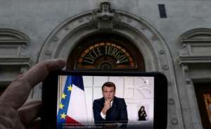 French President Emmanuel Macron again defended not locking down in January, citing recent such measures in Germany and Italy. By THOMAS COEX AFP