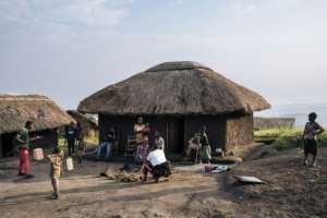 FRPI militiamen live at a base in Bukiringi with their wives and children. By ALEXIS HUGUET AFP
