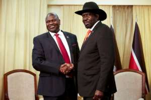 Handshake: President Salva Kiir right and his former vice president and rival, Riek Machar, pictured in Juba last October. The pair have until February 22 to form a coalition government scheduled under their 2018 peace accord.. By Alex McBride AFP