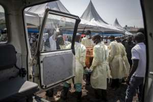 Health workers carry the coffin of an activist killed during a demonstration against UN peacekeepers last week. By Guerchom Ndebo AFP
