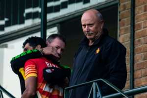 Hugs all round: Zimbabwe's influential coach David Houghton R looks on as batting coach Lance Klusener L congratulates Sikandar Raza after Sunday's win over Bangladesh. By Jekesai NJIKIZANA AFP