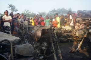 Hundreds of people gathered at the scene of the tragedy, many searching for missing relatives. By Saidu BAH AFP