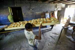 In December 2018, authorities raised the official price of a 70-gram loaf from one Sudanese pound to three, prompting a rush on bakeries and long queues. By ASHRAF SHAZLY AFP