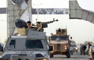 Joint forces affiliated with Libya's Government of National Unity assemble inside the closed Tripoli International Airport on August 16, 2022. By Mahmud Turkia AFPFile
