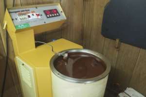 Just give me a tub: Chocolate testing in Claudio Corallo's workshop. By Adrien Marotte AFP