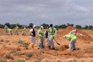 Libyan experts search for human remains on June 23 in an area southeast of Tripoli seized by the unity government from forces loyal to eastern strongman Khalifa Haftar. By Mahmud TURKIA AFPFile