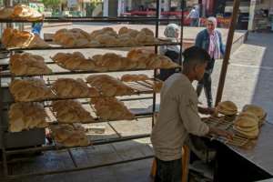 Life has been reduced to 'thinking about how much bread and eggs cost,' one Egyptian mother said. By Khaled DESOUKI AFPFile