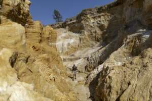 Lufuno Matidza takes the path through an abandoned mine. By GUILLEM SARTORIO AFP