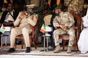 Mali's interim leader Colonel Assimi Goita R and Guinea's Mamady Doumbouya L are seen in Bamako during Mali's independence day military parade. By OUSMANE MAKAVELI AFP