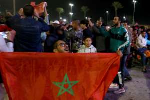Morocco's supporters in the Libyan capital Tripoli celebrate after their team beat Spain in the World Cup. By Mahmud Turkia AFP
