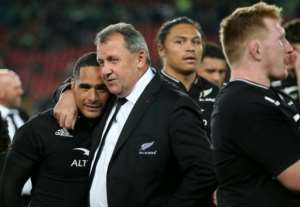 New Zealand coach Ian Foster embraces scrum-half Aaron Smith as they celebrate their victory. By PHILL MAGAKOE AFP