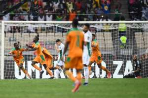 Nicolas Pepe 2nd L celebrates after scoring the Ivory Coast's third goal against Algeria. By CHARLY TRIBALLEAU AFP