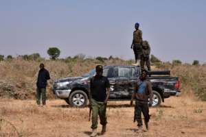 Nigerian security forces seen on the site of a sabotage attack allegedly perpetrated by Boko Haram on the outskirts of Maiduguri on February 12, 2021.. By Audu MARTE AFP