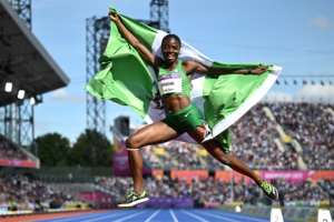 Nigeria's Tobi Amusan celebrates her gold medal in the women's 100m hurdles. By Ben Stansall AFP