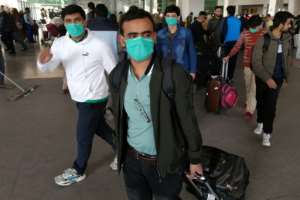 Pakistani students wearing protective face masks arrive from China at Islamabad International Airport. Pakistan is one of the few countriers to maintain flights to China during the crisis. By Aamir QURESHI AFPFile