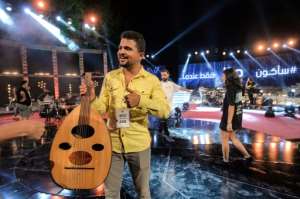 Palestinian musician Ahmed al-Qrinawi holding his oud. By SOFIENE HAMDAOUI AFP