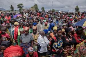 People displaced by the fighting in eastern DR Congo await a distribution of aid by UNICEF. By Guerchom Ndebo AFP