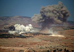 Plumes of smoke rise during a reported Russian bombing in Syria near the village of Hafsarja, in the rebel-held Idlib region, on September 8, 2022. By Abdulaziz KETAZ AFPFile