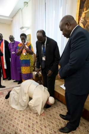 Pope Francis in April 2019 kissed the feet of South Sudan's President Salva Kiir centre and his deputy and rival Riek Machar.  By Handout VATICAN MEDIAAFPFile