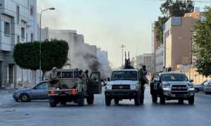 Pro-Dbeibah fighters circulating on Saturday in Tripoli. By Mahmud TURKIA AFP