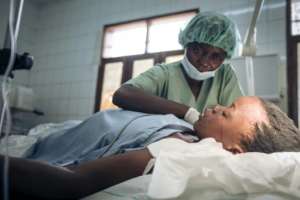 Rebecca Nzengi, 22, is one of the thousands of victims of the fighting -- she is being treated at a hospital in Goma for a machete wound to the head. By ALEXIS HUGUET AFP