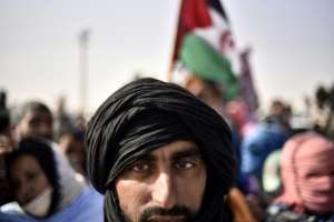 Sahrawis during celebrations marking the 45th anniversary of the declaration of the Sahrawi Arab Democratic Republic SDAR by the Polisario Front, at a refugee camp near the southwestern Algerian city of Tindouf, on February 27, 2021. By RYAD KRAMDI AFPFile