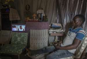 Screen time: There's even enough power left over to drive a small television. By AMOS GUMULIRA AFP