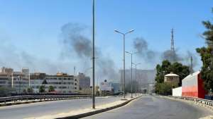 Smoke billows as rival Libyan groups exchange fire in the capital Tripoli. By Mahmud TURKIA AFP