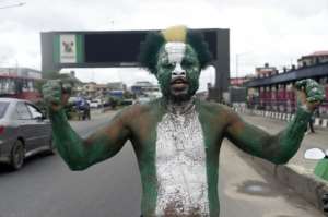 Some carried the green and white flags to mark Nigeria's 62nd independence day. By PIUS UTOMI EKPEI AFP