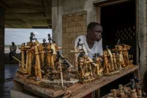 Souvenirs portraying traditional Wagenya life are on sale for the few tourists who visit the impoverished DR Congo area. By Guerchom Ndebo AFP