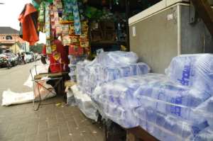 Street stalls in Lagos sell small packets of everything from coffee to mosquito cream. By PIUS UTOMI EKPEI AFP