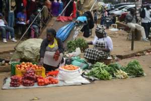 Street vendors known as 'mama mboga' are found in markets and on roadsides across Kenya. By Simon MAINA AFP