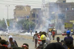 Sudanese demonstrators threw tear gas canisters back at security forces in the capital Khartoum. By - AFP