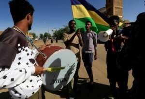 Sudanese protesters beat drums and chant slogans in the capital Khartoum, in support of the families of protesters killed since last year's military coup. By - AFP