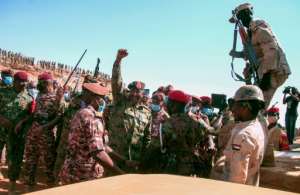 Sudan's top general Abdel Fattah al-Burhan, pictured here on December 8 greeting soldiers during a military exercise, led a military takeover on October 25. By Ebrahim HAMID AFP