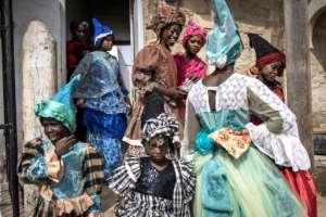 The dresses are of another era -- puffy below the waste, adorned with ruffles and lace, matching headdress and shawls. By JOHN WESSELS AFP