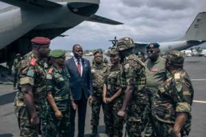 The Kenyan troops were greeted by local dignitaries. By ALEXIS HUGUET AFP