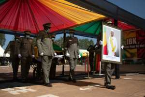 The ousted president was to be buried at his Bamako residence later in the day. By FLORENT VERGNES AFP