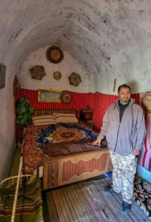 The underground houses were hewn into the mountainside centuries ago, and many lie abandoned, but residents hope tourism can help restore their heritage. By Mahmud TURKIA AFP