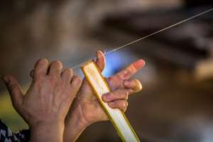To make paper, wire is used to cut the stems into thin strips, which are immersed in water and then layered on top of each other to create sheets. By Khaled DESOUKI AFP