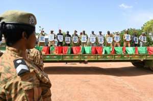 Toll: A funeral for 27 soldiers who were killed in an ambush in August as they escorted a large convoy of truck in the north of the country. By Issouf SANOGO AFP