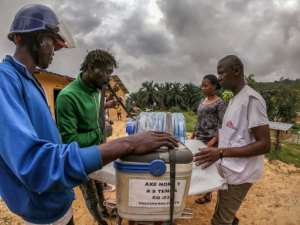 Transport task: A motorcycle driver loads vaccines for transport into rural areas in Seke Banza in western DR Congo. By JUNIOR KANNAH AFP