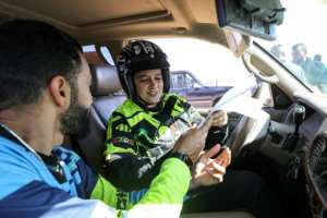 Tunisian Chaima Ben Ammou -- the first woman to compete -- said her passion for motorbikes came from her father, who still accompanies her to both national and international fixtures. By Mahmud Turkia AFP