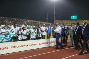 VIP moment: The president of the Confederation of African Football, Patrice Motsepe, third right, meets the Minawao refugee team. By Daniel Beloumou Olomo AFP