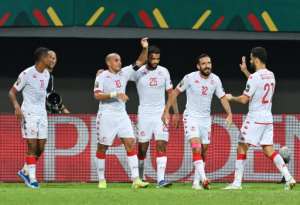 Wahbi Khazri 2L celebrates with teammates after scoring in Tunisia's win over Mauritania in Limbe. By Issouf SANOGO AFP