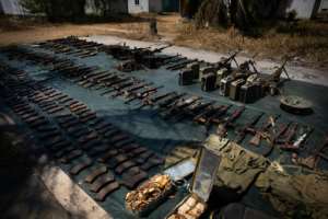 Weapons confiscated from the insurgents are displayed by Rwandan troops in Mocimboa da Praia last September. By Simon WOHLFAHRT AFPFile