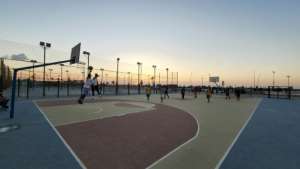 Youths play basketball on an outdoor court in the Libyan capital Tripoli, before fighting erupted. By Mahmud TURKIA AFP